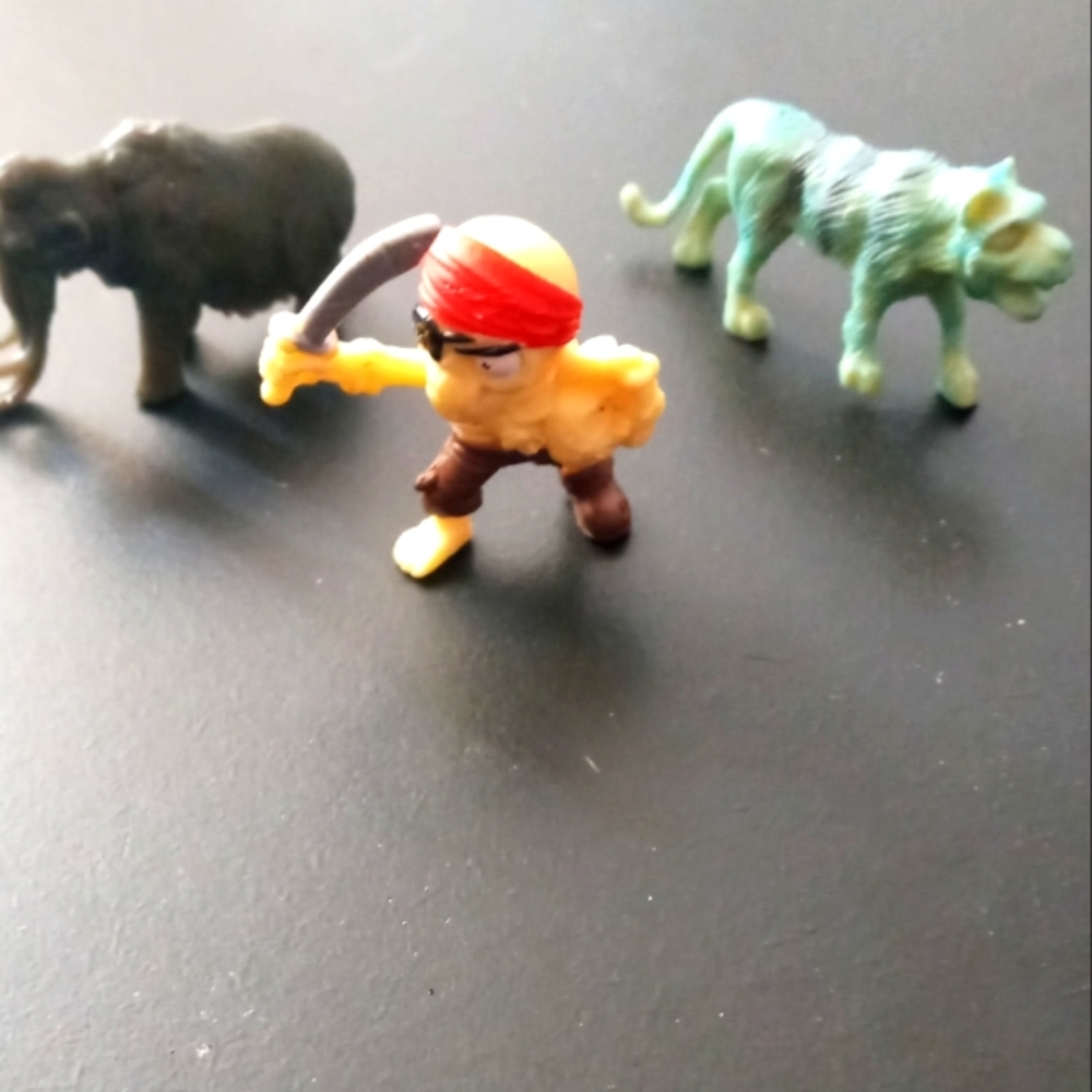 Micro Pirate Figure Toy with Red Bandana and Brown Pants and wild animals